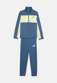 Blå och ljusgul Puma-träningsdräkt med zip-up jacka och matchande byxor, med Puma-loggor på bröstet och låret.