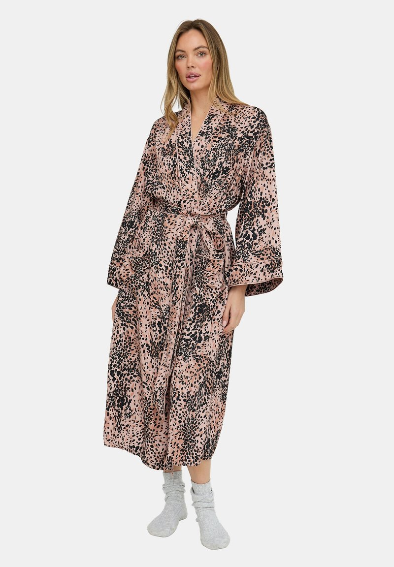 Long, patterned robe in soft fabric featuring a pink background with black spots and abstract designs. Includes a tie waist and wide sleeves.
