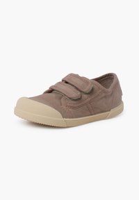 Pantof și plat din pânză de culoare bej deschis, cu benzi Velcro, vârf rotunjit din cauciuc și talpă bej texturată. Design minimalist cu accente cusute.