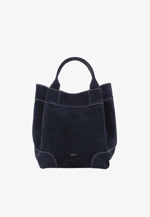 Navy suede tote bag with double handles, featuring contrasting white stitching and a rounded base. Simple design with no visible hardware.