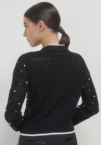 Calliope CON PERLE - Strickjacke - ultrablack