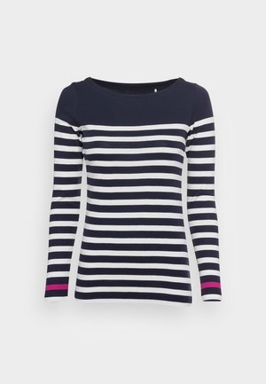 Maglietta a maniche lunghe a righe blu navy e bianche con un ampio scollo e un accento fucsia sulla fine delle maniche. Materiale di cotone liscio.