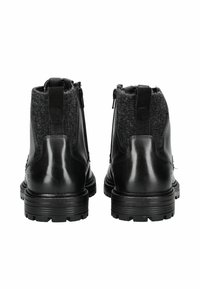 Zwarte leren enkelboots met textuur grijs stof bij de kraag, dubbele zijritsen en dikke rubberen zolen voor grip.