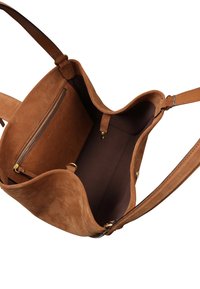 Brown suede handbag featuring a single strap and an open top design. Inside includes a zippered pocket and smooth, dark lining.