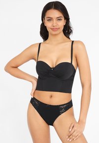 Black lingerie set featuring a padded corset-style bra with lace trim and a matching lace-accented brief. Smooth fabric.