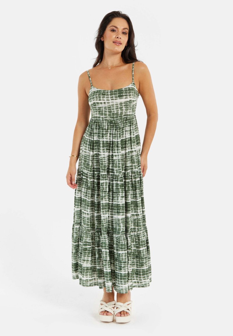 Green and white tiered maxi dress with spaghetti straps, featuring a tie-dye pattern and a relaxed fit, made from soft fabric.