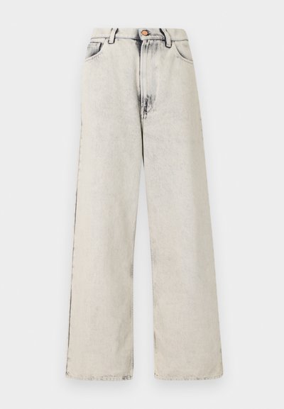 Wide-leg jeans in a light beige color with faded, distressed accents. Features five pockets and a metal button closure at the waist.