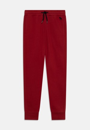 ESSSENTIALS - Pantalones deportivos - red