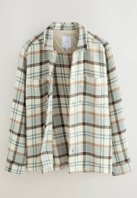 Chemise à manches longues avec col, présentant un grand motif écossais beige, bleu clair, marron et crème, ainsi qu'une poche poitrine unique.