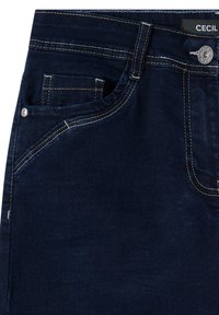 Donkerblauwe denimmicrojeans met contrasterend gele stiksels, met vijf zakken, een sluiting met een knoop aan de voorkant en een merklabel op de tailleband.