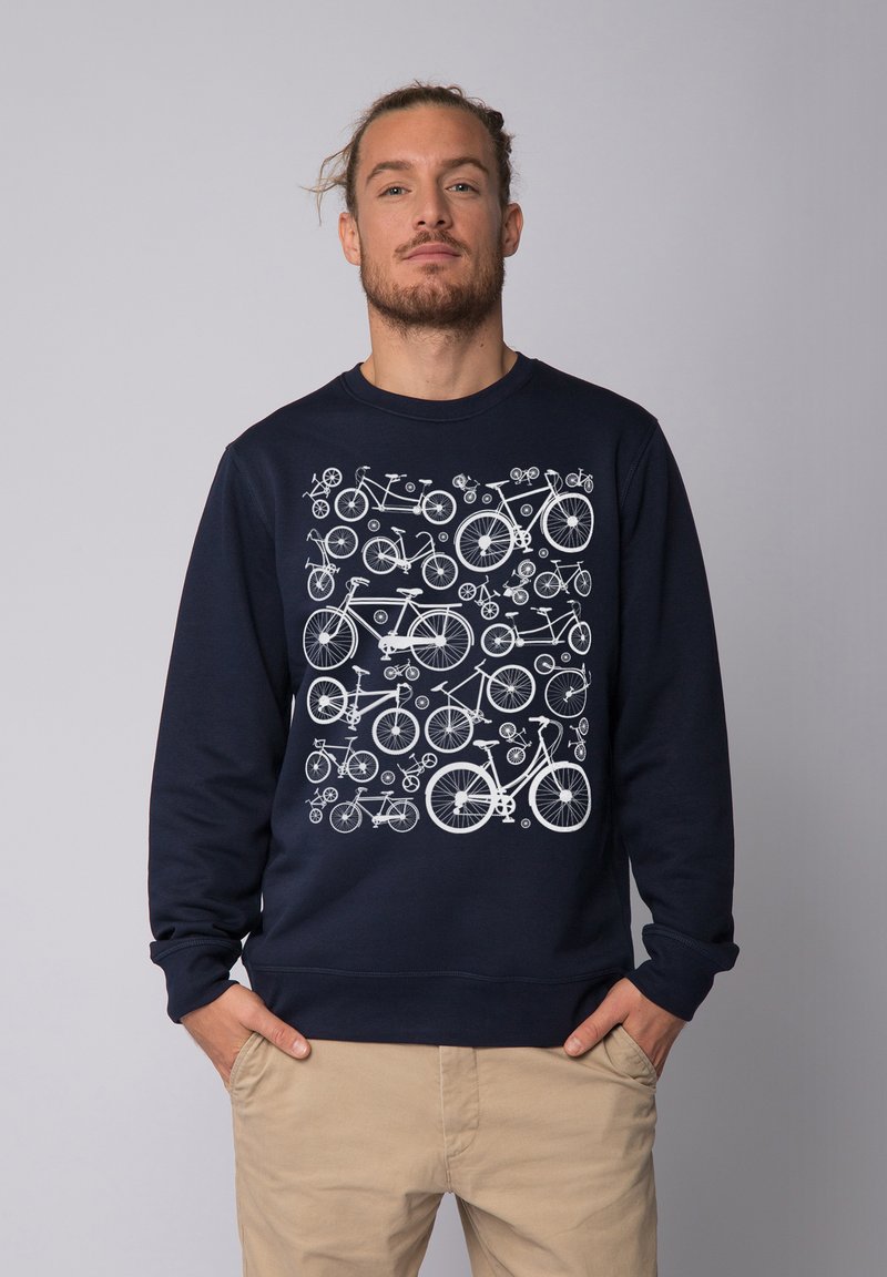 Marineblauw sweatshirt met een wit fiets patroon op de voorkant. Het materiaal is zacht, met een ronde hals en geribbelde mouwen en onderkant.