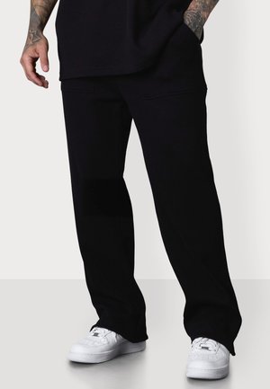 WAFFLE - Tracksuit bottoms - black