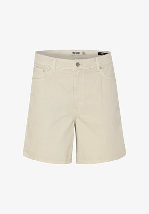 Bež kratke hlače od chinoa izrađene od pamučne tkanine, s patentnim zatvaračem, prednjim džepovima i glatkom teksturom. Prisutna su suptilna šavova.