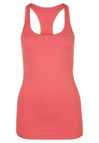 Koralli vaaleanpunainen urheilutoppi, jossa on pieni hopeinen Puma-logo ylärinnassa, slim fit -tyyli, saumaton muotoilu.