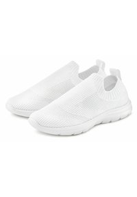 White slip-on shoes with a textured knit upper and elasticized opening, featuring a flexible sole and subtle ridges on the surface.