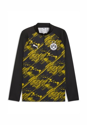 Zwart en geel langärmelig sportshirt met abstract patroon, halve ritskraag, Puma-logo en BVB 09 voetbalclubembleem op de borst.