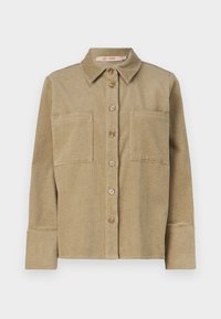 Beige kordfløyels skjortejakke med knapp foran, to brystlommer og krage. Har et strukturert ribbet design og oppbrettede lange ermer.