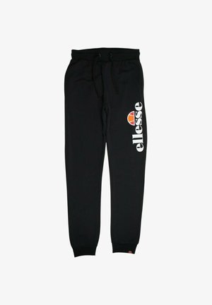 Pantalon de survêtement noir en tissu doux avec une taille à cordon. Il présente un logo blanc et un emblème coloré sur la jambe gauche.