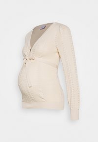 Cardigan de maternité en tricot beige avec un col en V, des manches longues et une ceinture à nouer à la taille. Présente des motifs texturés et une coupe ajustée.