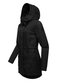Black waterproof jacket with a hood, cinched waist, front zipper, and snap buttons. Features side pockets and elastic drawstrings.