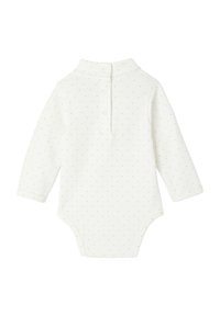 Long-sleeve baby bodysuit in white with small golden polka dots, featuring a collar and snap closure at the back. Soft, stretchy fabric.