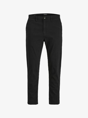 Schwarze Chinos mit slim fit, aus Baumwolle. Mit Knopfverschluss, Fronttaschen und einer glatten Textur. Sauberes Design ohne Muster.