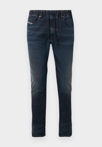 Tumesinised teksapüksid elastse vöökohaga, paelaga kinnitusega ja viie taskuga. Sile tekstuur peene pleekimisega detailidel.