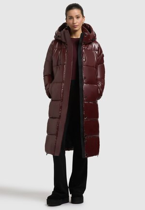Burgundy padded long coat with a glossy finish, hood, and zipper closure. Features large compartments and black accents.