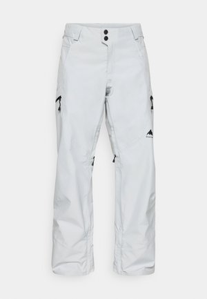 Pantaloni de zăpadă albaștri, confecționați din material impermeabil, cu buzunare laterale cu fermoar, închidere cu nasture și accente cu logo aproape de tiv.