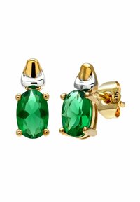 Pendientes ovalados de color verde esmeralda, montados en metal dorado y plateado; cuentan con cuatro garras que sujetan las piedras preciosas; acabado pulido.