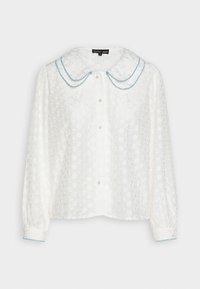 White blouse with floral pattern, featuring a large blue-trimmed collar, long sleeves, and pearl buttons down the front. Lightweight, textured fabric.