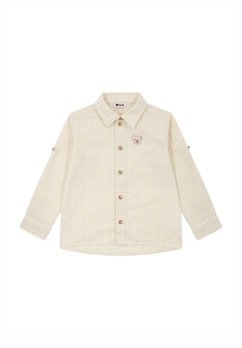Chemise enfant crème à manches longues avec fines rayures verticales, boutonnière devant, col et petit patch visage d'ours sur la poitrine gauche.