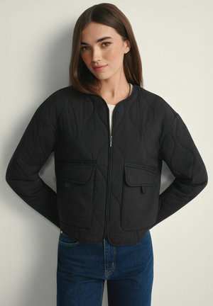 - Kurtka przejściowa