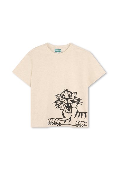 T-shirt en coton beige avec un grand graphisme de tigre noir sur le devant. Manches courtes et coupe décontractée avec un col rond.