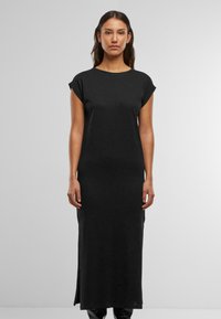 Must have mustel dress, lühikesed varrukad, ümar kaelus ja külgjaheneg. Valmistatud pehmest kangast, millel on sile tekstuur. Lihtne, minimalistlik disain.