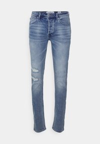 Světlé modré džíny s úzkým střihem, s distressed vzorem na levém stehně, pěti kapsami a klasickým zapínáním na knoflík a zip.