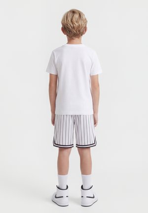 Karl Kani SMALL SIGNATURE JUNIOR - Tracksuit bottoms - white