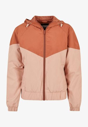 Gevoerde jas met een kleurblokontwerp in roestkleur en lichtroze, met elastische manchetten, een voorrits en een gestructureerde voering.