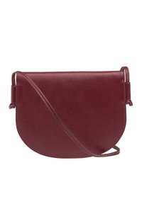 Burgundy leather crossbody bag with a rounded shape, smooth texture, and thin adjustable strap, featuring minimalist design and no visible hardware.