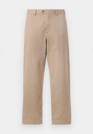 Pantaloni chino beige realizzati in cotone leggero, dotati di zip con chiusura a bottone e design a gamba dritta con tasche anteriori.