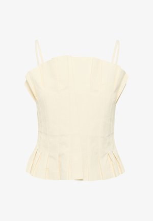 Kermapunä, lühike tops õhukeste rihmadega, mis sisaldab vertikaalseid voldikuid ja laiendavat hemmi koos peente volditud detailidega.