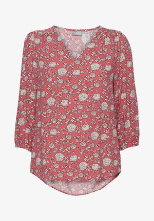 Bloes met bloemenpatroon in koraalkleur met een V-hals. Voorzien van 3/4 mouwen en een gebogen zoom. Design bevat witte en zwarte bloemenpatronen. Lichtgewicht stof.