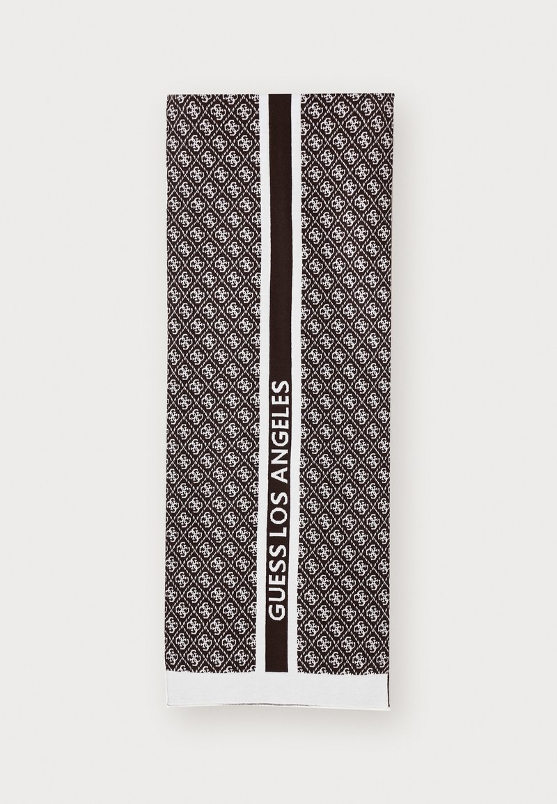 Strandhåndkle i svart og hvitt med et mønster som har et gjentakende logo-design og en sentral stripe med teksten "GUESS LOS ANGELES". Myk tekstur.