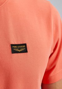 PME Legend AMERICAN pomarańczowy