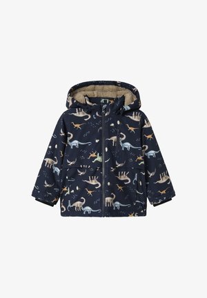 Casaco azul marinho com padrão de dinossauros em várias cores, com capuz forrado a pelo e bolsos frontais. Inclui fecho de correr.