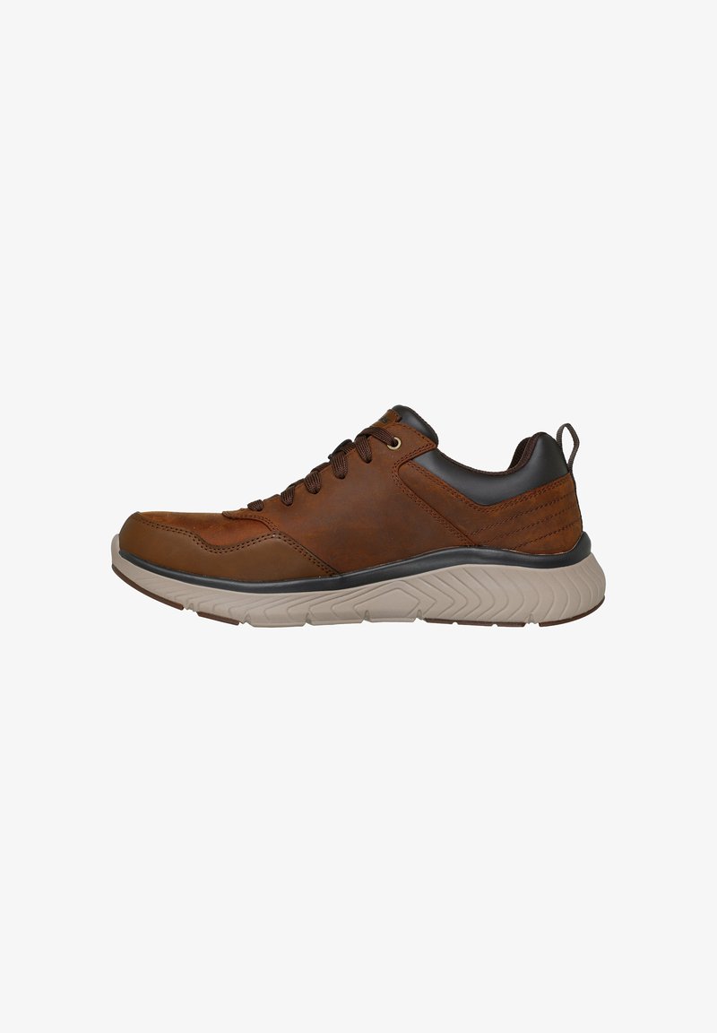 Brown leather sneaker with a grey rubber sole, rounded toe, lace-up front, and contrasting dark accents at the heel and tongue.