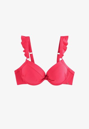 Soutien-gorge rouge à armatures avec bonnets moulés et bretelles à volants sur fond blanc.