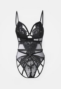 Musta pitsinen bodysuit, jossa on tuki ja säädettävät hihnat. Sisältää läpikuultavan verkko-osan, monimutkaiset pitsikuviot ja koristeelliset metalliosat.