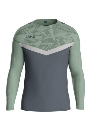 Langärmliges Sportshirt in Grün und Grau, mit einem strukturierten Muster im oberen Bereich und einem kontrastierenden grauen Chevron-Design.