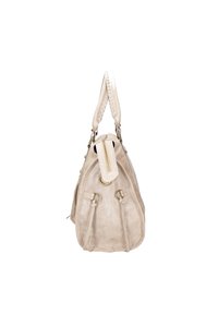 Sac à main en daim beige de forme arrondie, avec une anse tressée, des finitions dorées et des accents à cordon de serrage sur les côtés. Fermeture éclair sur le dessus.